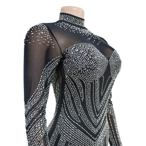 Detail of black mesh bodysuit with intricate silver rhinestone patterns and mock neck