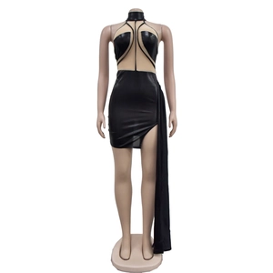 Detail of black mini dress with mesh cutouts and long side-cape fabric decoration