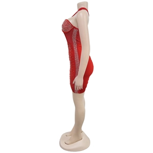 Detailed view of red bodycon mini dress featuring intricate silver rhinestone patterns