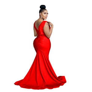 Detail of red satin mermaid dress showing deep V-back and gathered waist ruffles