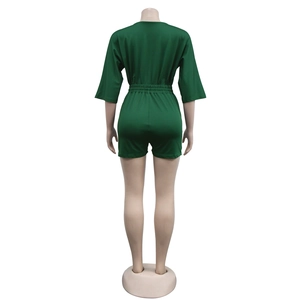 Rear view of a dark green short romper with half sleeves and elastic waist detail