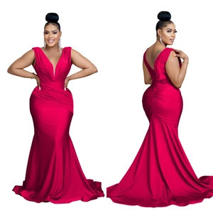 Detail of deep V-neck and ruched satin fabric on this elegant red fishtail evening gown