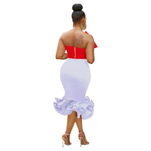Detail view of red strapless top with gold zipper and white ruffled mermaid skirt back