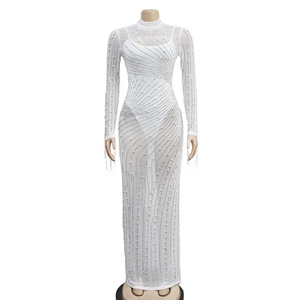 Close-up of white sheer mesh dress with pearls and rhinestones over a solid lining