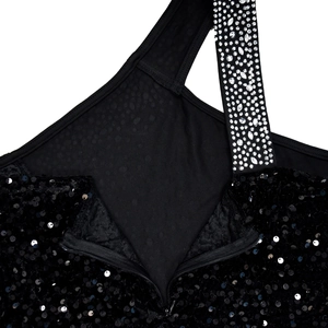 Detail of black sequined dress showing silver rhinestone strap and zipper closure