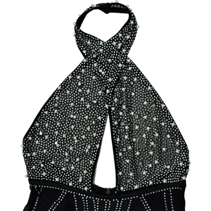 Detail of mesh romper with silver rhinestones and white pearls on halter neckline