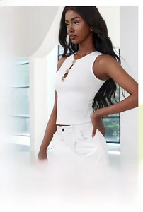 Detail of white ribbed tank top featuring three silver star-shaped metal buttons on chest