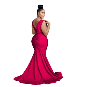 Detail of red V-neck mermaid maxi dress featuring ruched back and sleek floor-length hemline