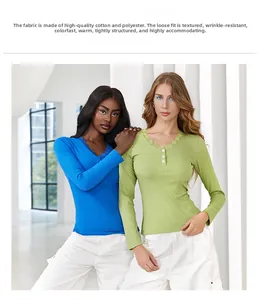 Detailed view of elegant lace trim and button placket on a long sleeve T-shirt for women