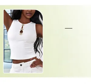Detail of white ribbed tank top featuring golden sun buckles and hollow-out neckline