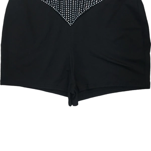 Detail of black high-waisted shorts featuring sparkling V-shaped rhinestone embellishments