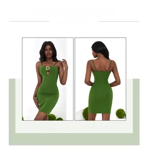 Detail of green bodycon dress featuring chest cutout and sun-shaped metal buckle