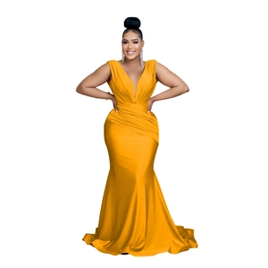 Detail of elegant bright yellow V-neck sleeveless satin dress with waist pleats and fishtail hem