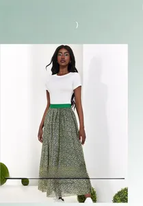 Detail of high-waisted green animal print midi skirt with elastic waistband and relaxed fit