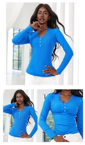 Detail of bright blue V-neck ribbed knit top with delicate lace trim and white buttons