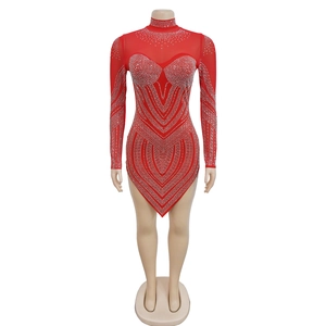 Detail of red mesh mini dress with silver rhinestone V-pattern and irregular hemline