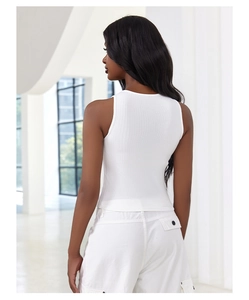 Close-up of white ribbed tank top showing slim fit cut and textured fabric detail