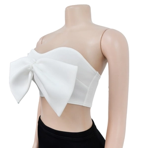 Detail view of white strapless tube top featuring a large bow and sweetheart neckline