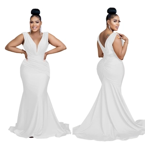 Detail view of white satin evening gown featuring V-neck and ruched waist design