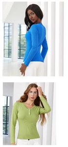 Close-up of ribbed long-sleeve tops featuring delicate lace trim and button details