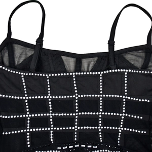 Detail of adjustable straps and silver rhinestone grid on mesh sleeveless black dress