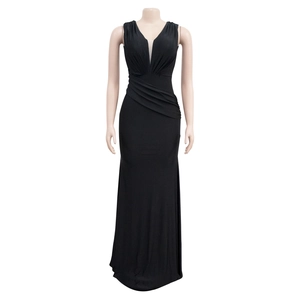 Detail of elegant V-neckline with mesh insert and side pleats on black sleeveless dress