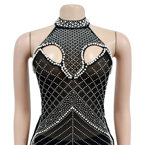 Detail of mesh bodysuit featuring rhinestone diamond patterns and faux pearl trim