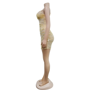 Detailed side view of champagne mini dress with sparkling yellow and silver rhinestones