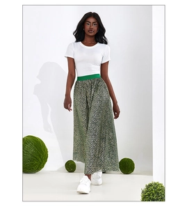 Close-up of high-waisted leopard print A-line skirt with green elastic waistband
