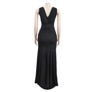 Detail of the elegant backless V-neck black evening dress with mermaid pleats and hidden zipper