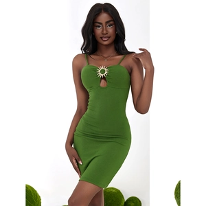 Sexy green bodycon mini dress with sun-shaped metal charm and hollow out detail