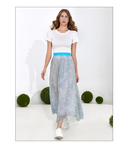 Detail of light blue metallic pleated skirt with high waist and fine pleat texture