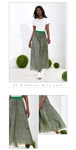 Detail view of high waist green leopard print skirt with comfortable elastic waistband