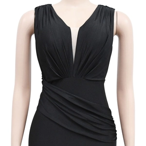 Detail of elegant black V-neck maxi dress featuring sophisticated pleats and gathered waist
