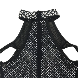 Close-up of halter dress detailing with luxury pearls and sparkling silver rhinestones