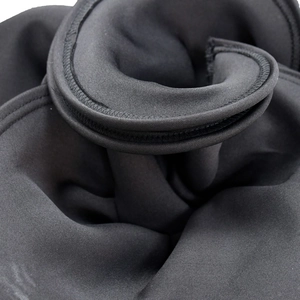 Macro shot of black elastic fabric with reinforced zig-zag stitching on edges