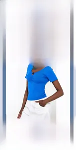 Detail view of royal blue V-neck crop top with button and ruched texture accents