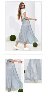 Detail of light blue pleated skirt with gold metallic threads and wide elastic waistband