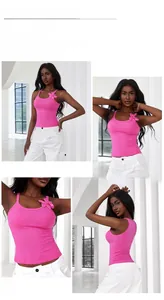 Detail of slim fit rose pink crop top with 3D floral accent on shoulder strap