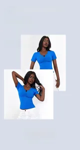Detailed macro view of the blue ribbed slim fit T-shirt with pleated neckline and dark buttons