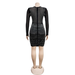 Detail of black mini dress with rhinestone patterns and back invisible zipper closure