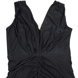 Detail of elegant black V-neck sleeveless dress with stylish pleated texture and slim fit