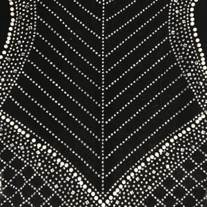Detailed view of mesh fabric featuring white pearls and square sequins in V-shape