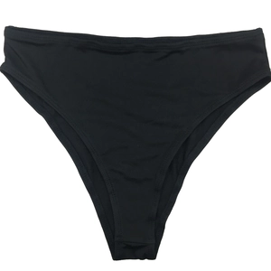Close-up of black high-waisted briefs featuring a fine ribbed texture and seamless edges