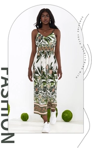 Detail of floral V-neck maxi dress with orange geometric patterns and delicate straps