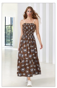 Detail of bohemian floral maxi dress featuring elastic smocked bodice and thin straps