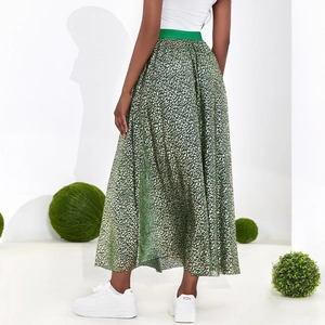 High waist leopard print maxi skirt with contrasting green elastic waistband on model