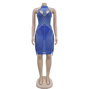 Detail of dark blue mesh dress with white pearls, rhinestones and fringe hemline