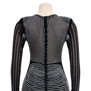 Back view of black mesh party dress with silver rhinestones and invisible zipper detail