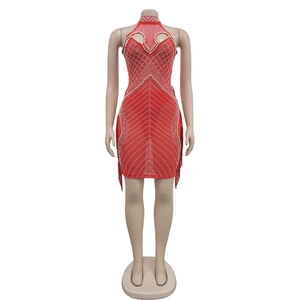 Detailed view of red halter mini dress with mesh rhinestones and layered side tassels